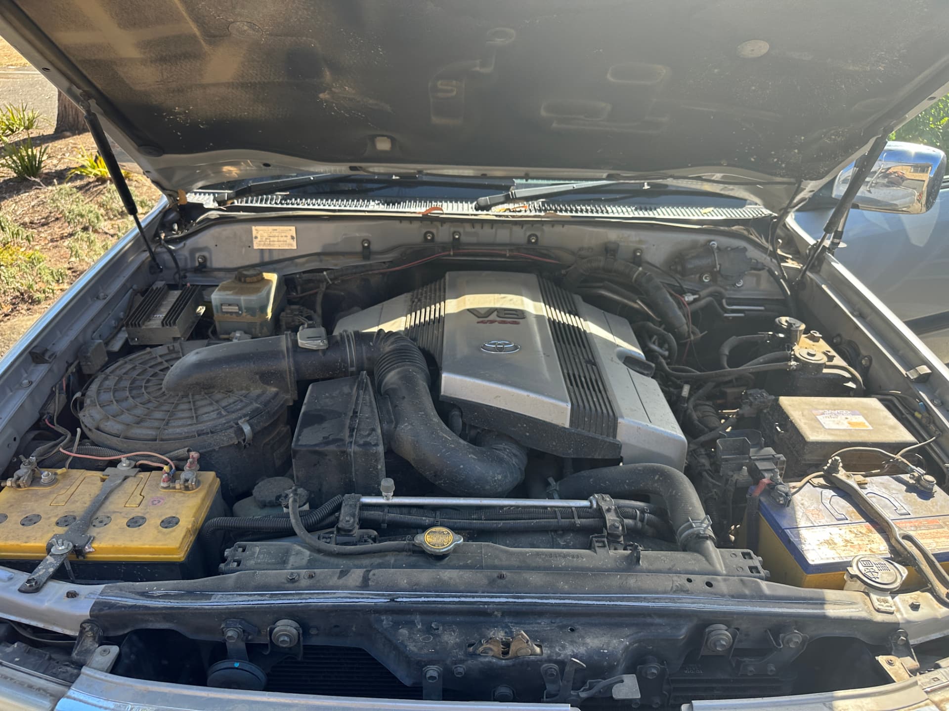 Before — Toyota Land Cruiser V8 engine bay before and after a professional engine bay clean