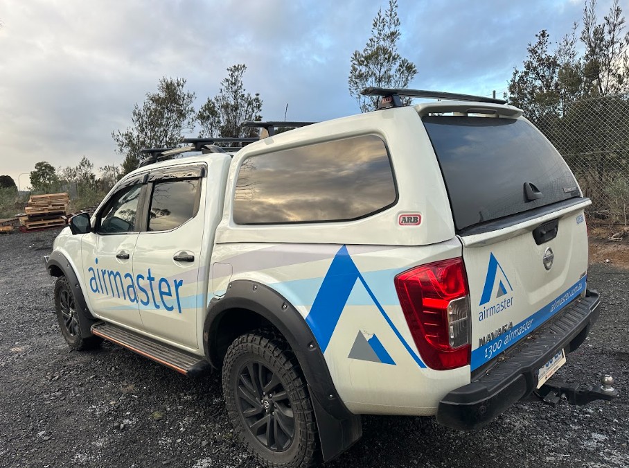 Before — Sticker & Decal Removal — Signage and decals removed from a work ute