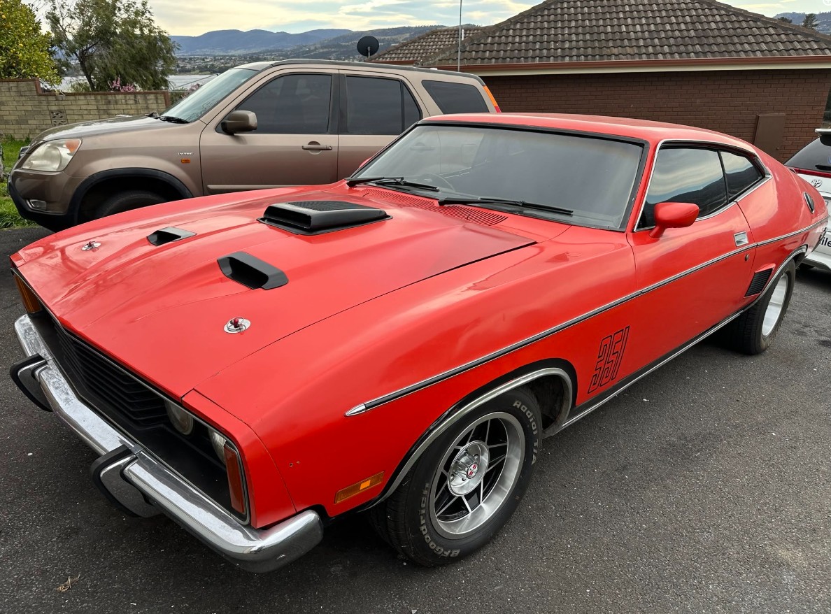 Classic red Ford Falcon coupe detailed to a deep gloss in Hobart