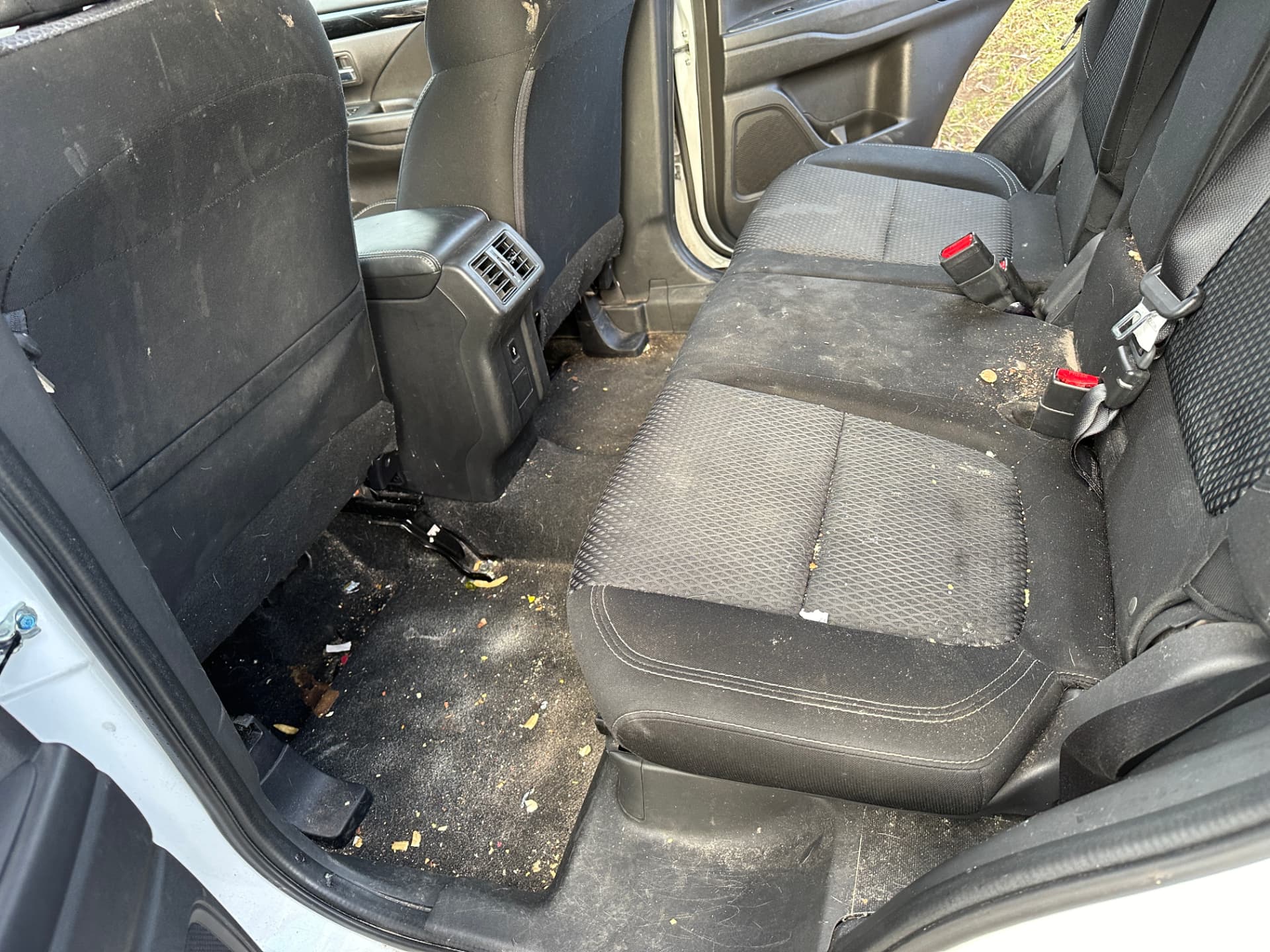Before — Mitsubishi Outlander rear seats and floor before and after an interior detail