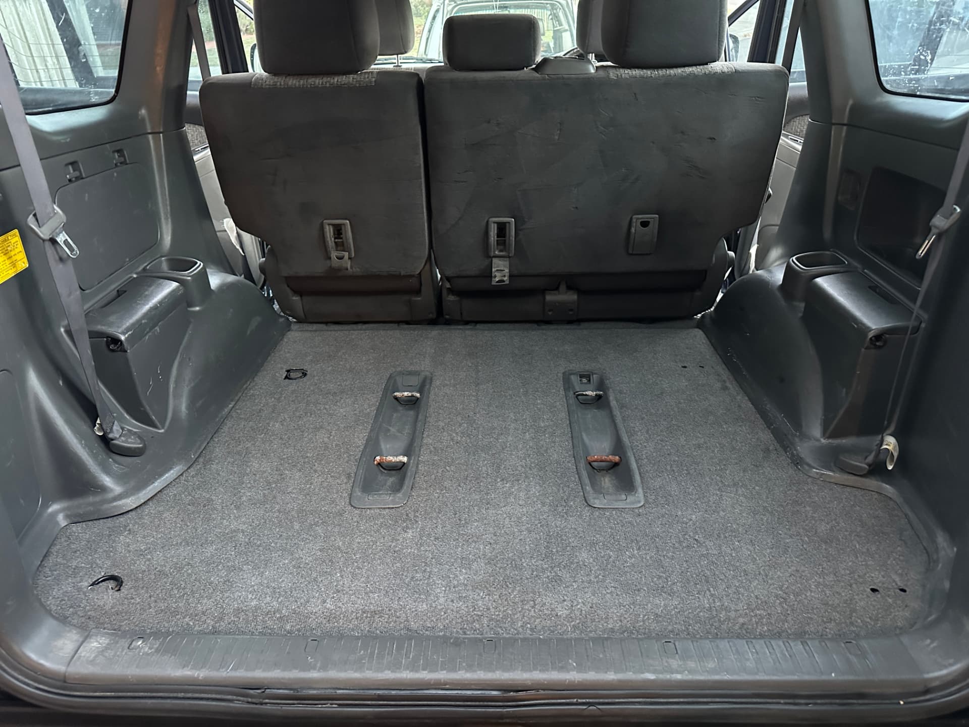 After — Toyota Prado rear cargo area before and after a deep interior clean