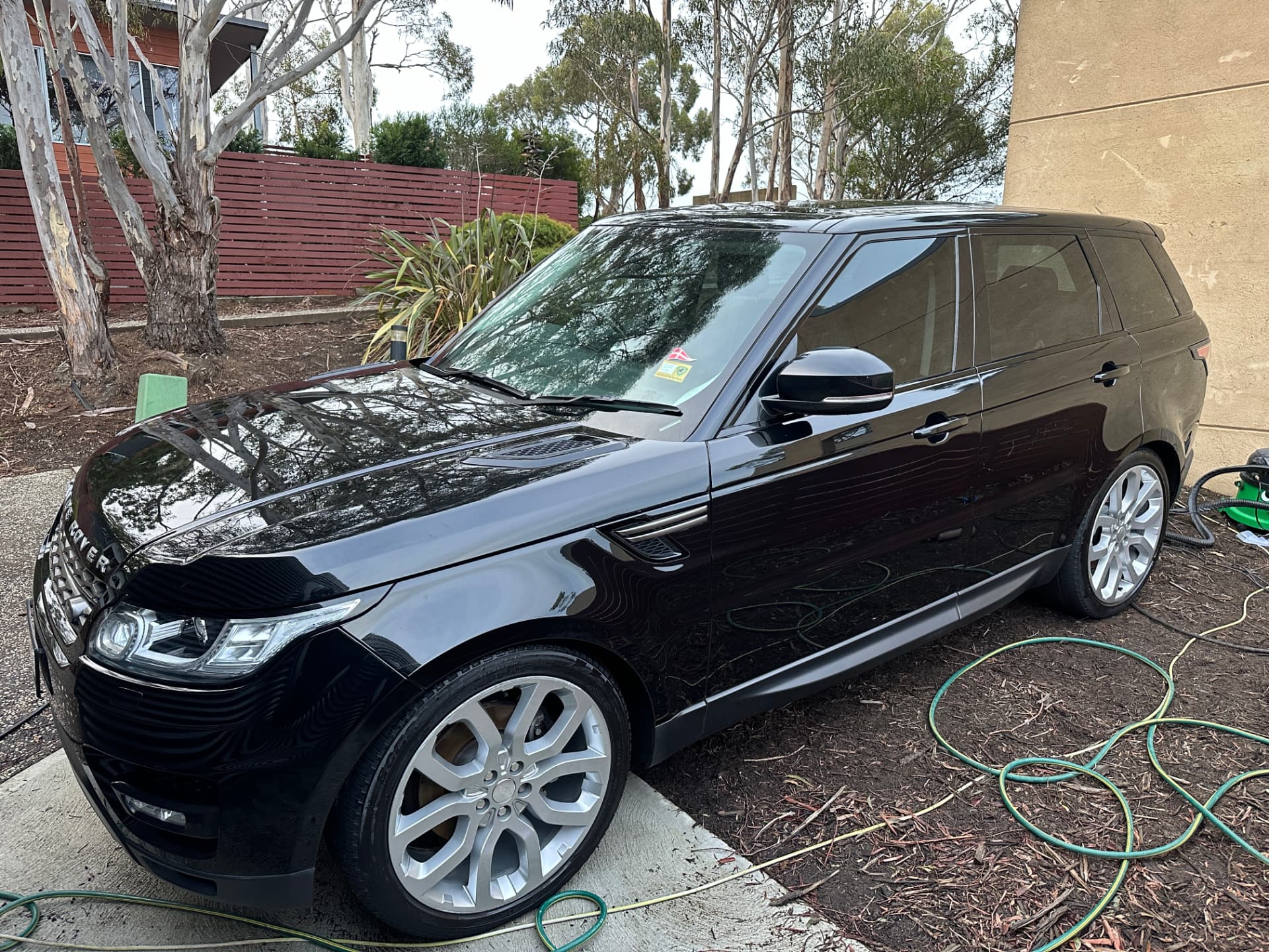 After — Black Range Rover Sport before and after an exterior detail