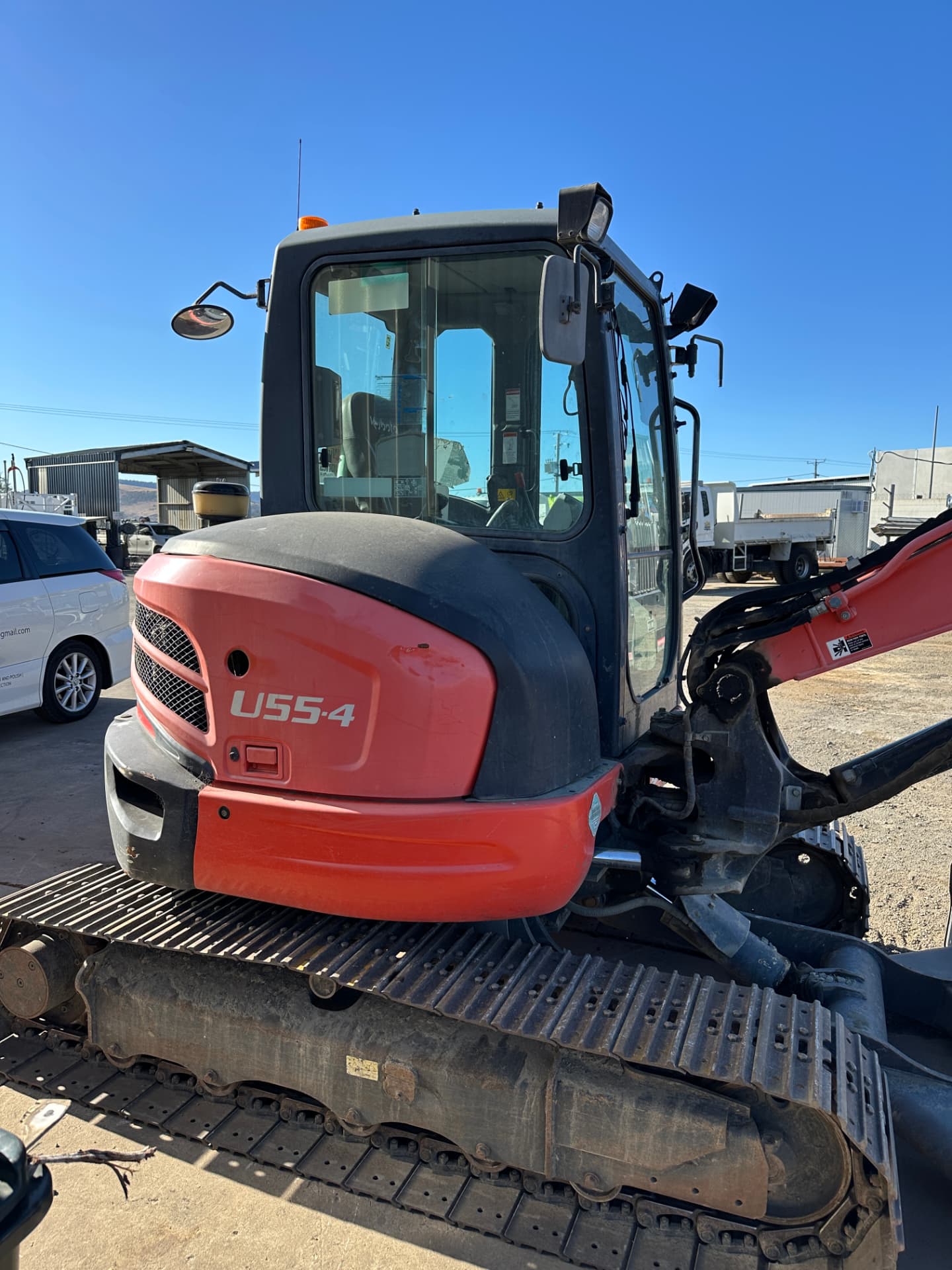 Before — Kubota U55-4 mini excavator before and after a machinery detail