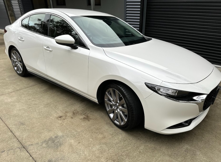 White Mazda3 sedan detailed and polished in Hobart