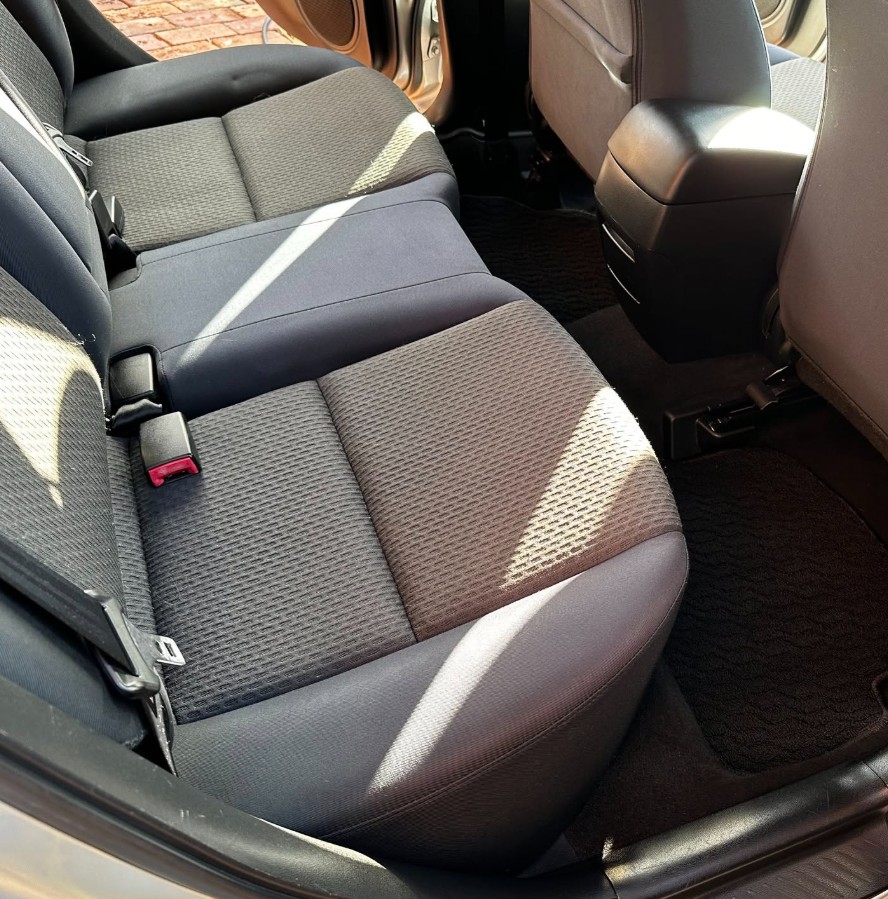 Rear seat upholstery deep cleaned in a mobile interior detail
