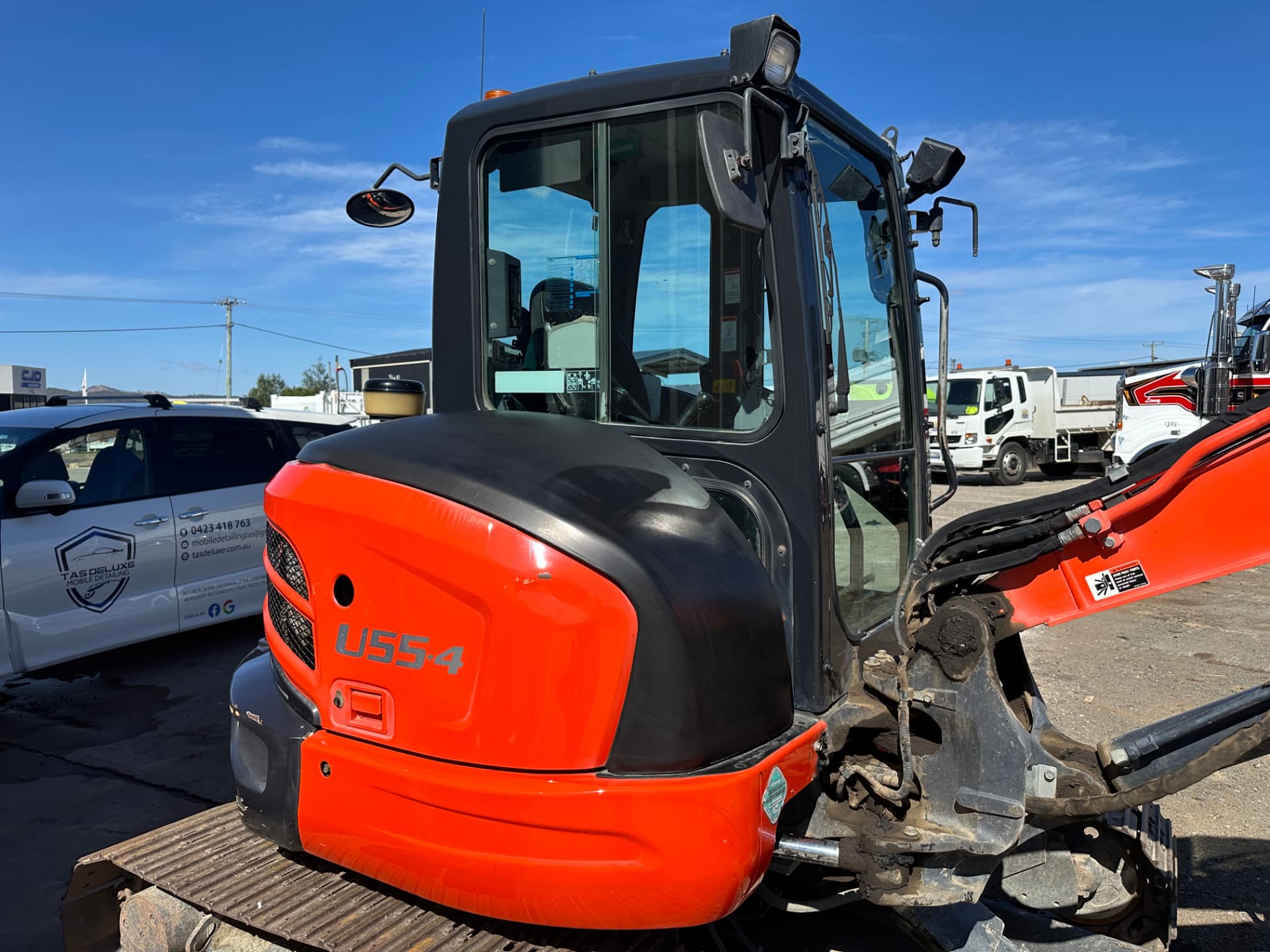 After — Kubota U55-4 mini excavator before and after a machinery detail
