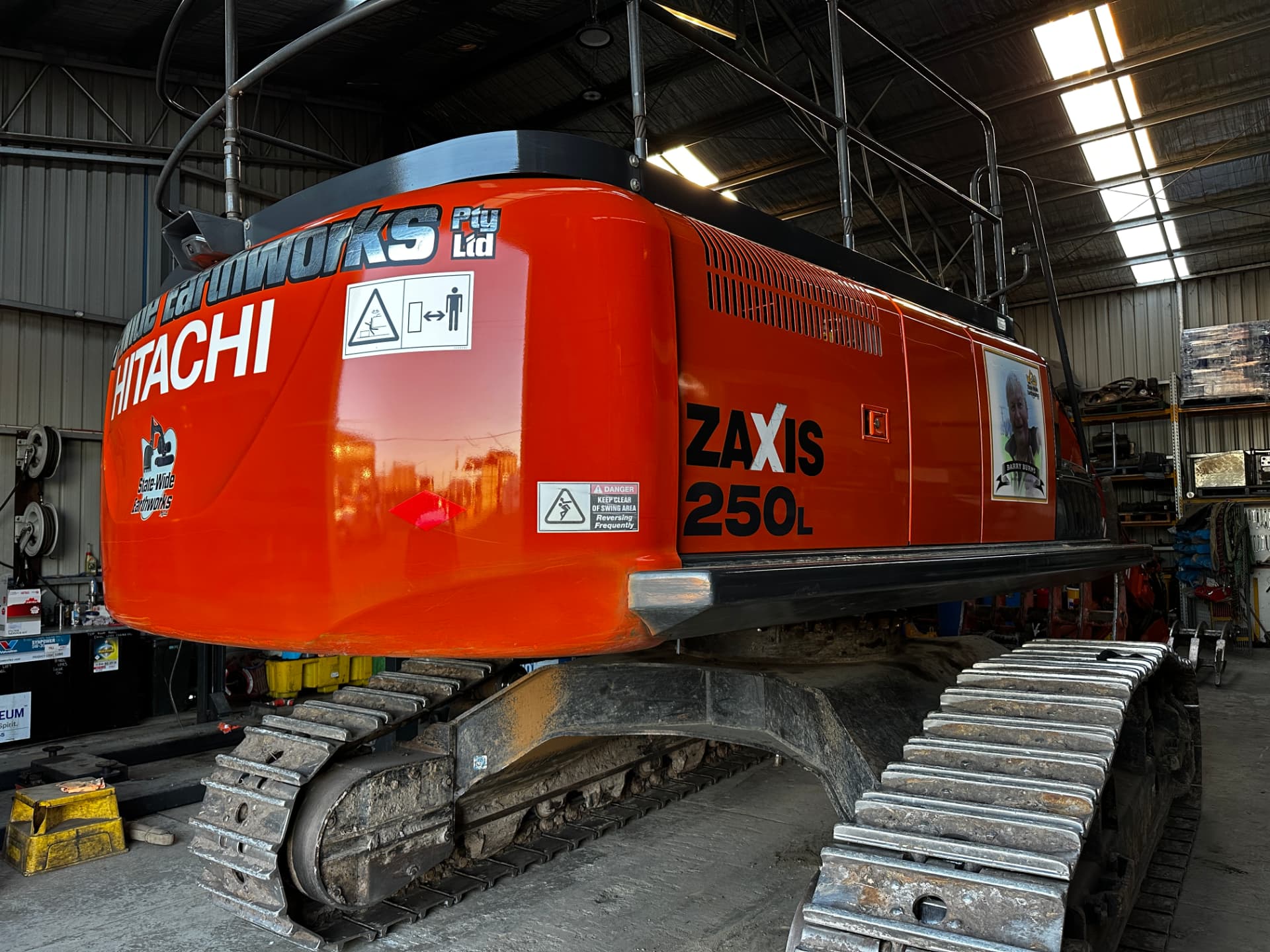 After — Hitachi Zaxis 250L excavator before and after a full machinery detail