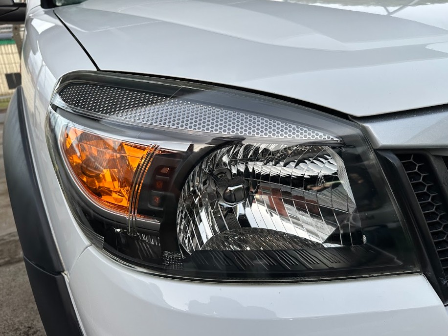 After — Headlight Restoration — Yellowed headlight restored to a clear finish