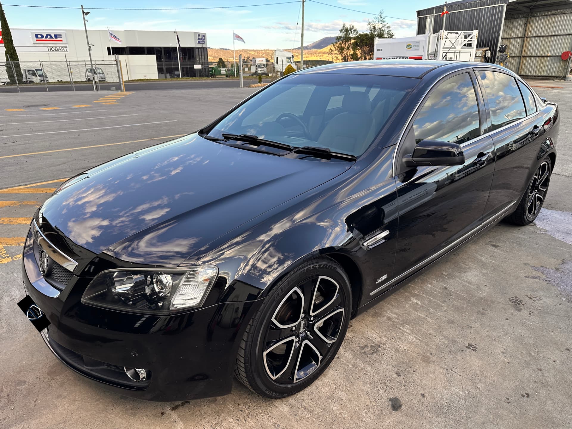 After — Black Holden Commodore before and after a cut and polish in Hobart
