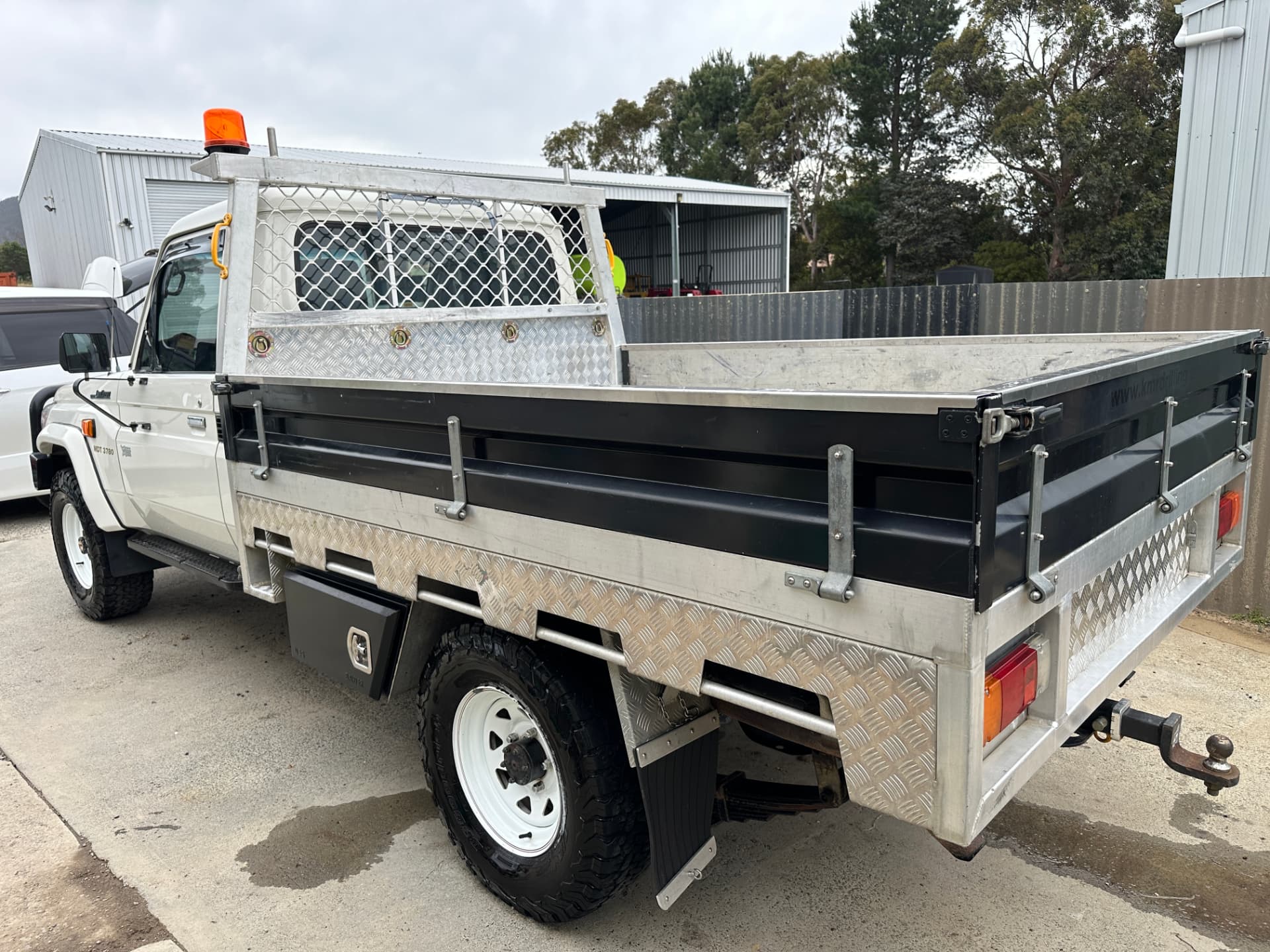 After — Land Cruiser tray ute before and after signage and decal removal