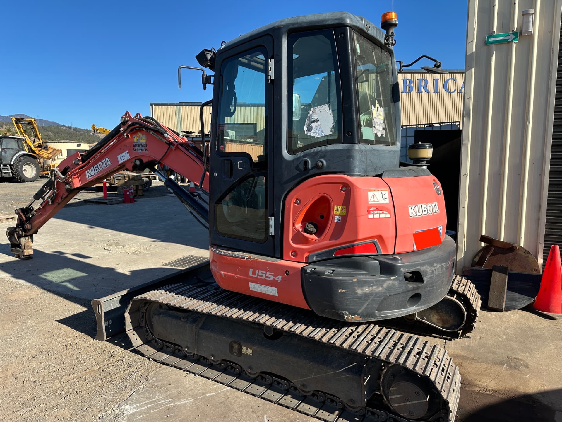 Before — Kubota U55-4 excavator rear before and after cleaning and polishing