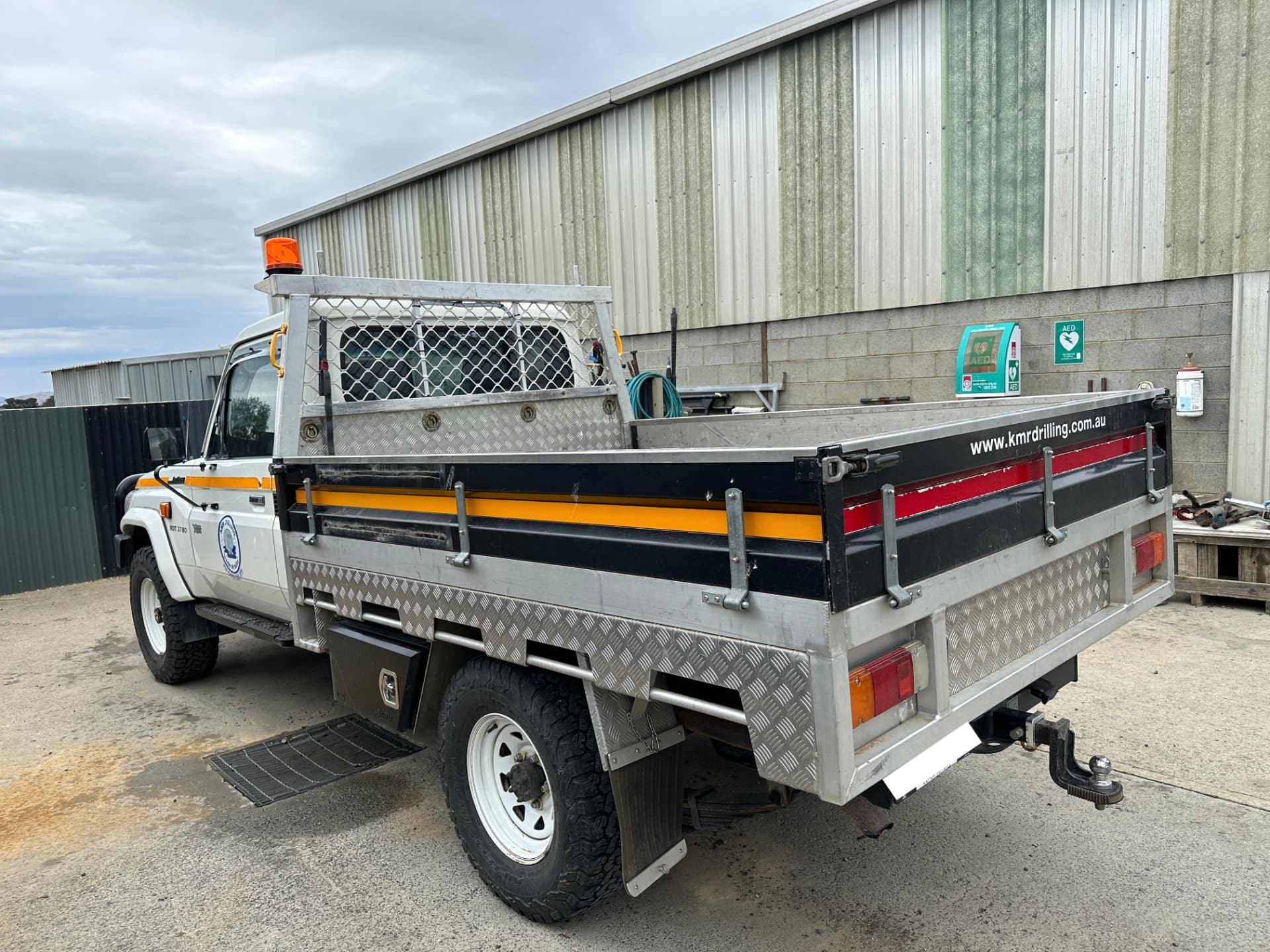 Before — Land Cruiser tray ute before and after signage and decal removal