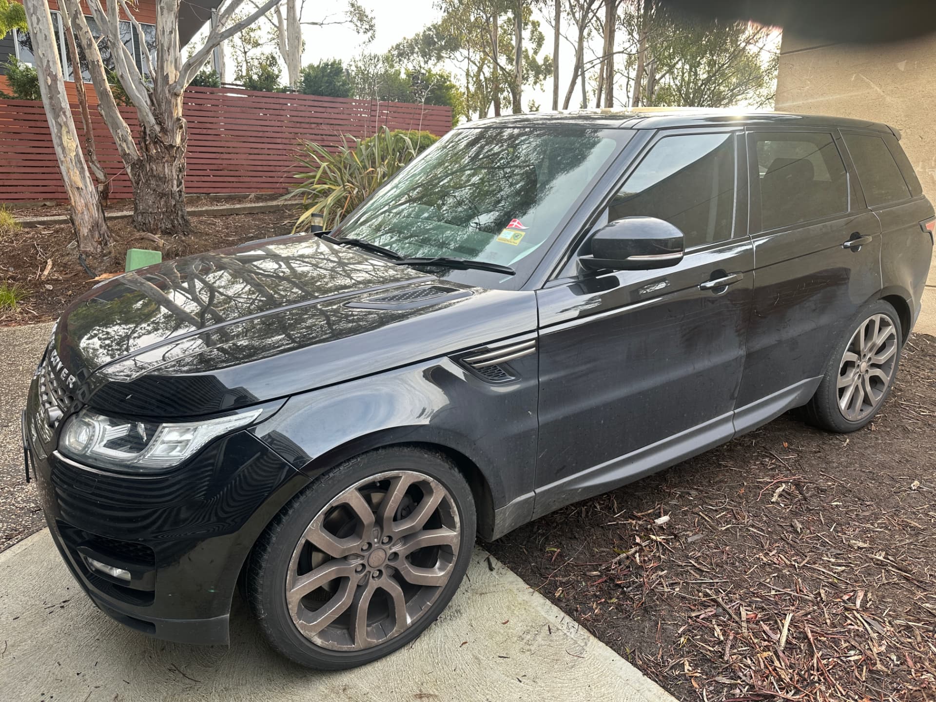 Before — Black Range Rover Sport before and after an exterior detail